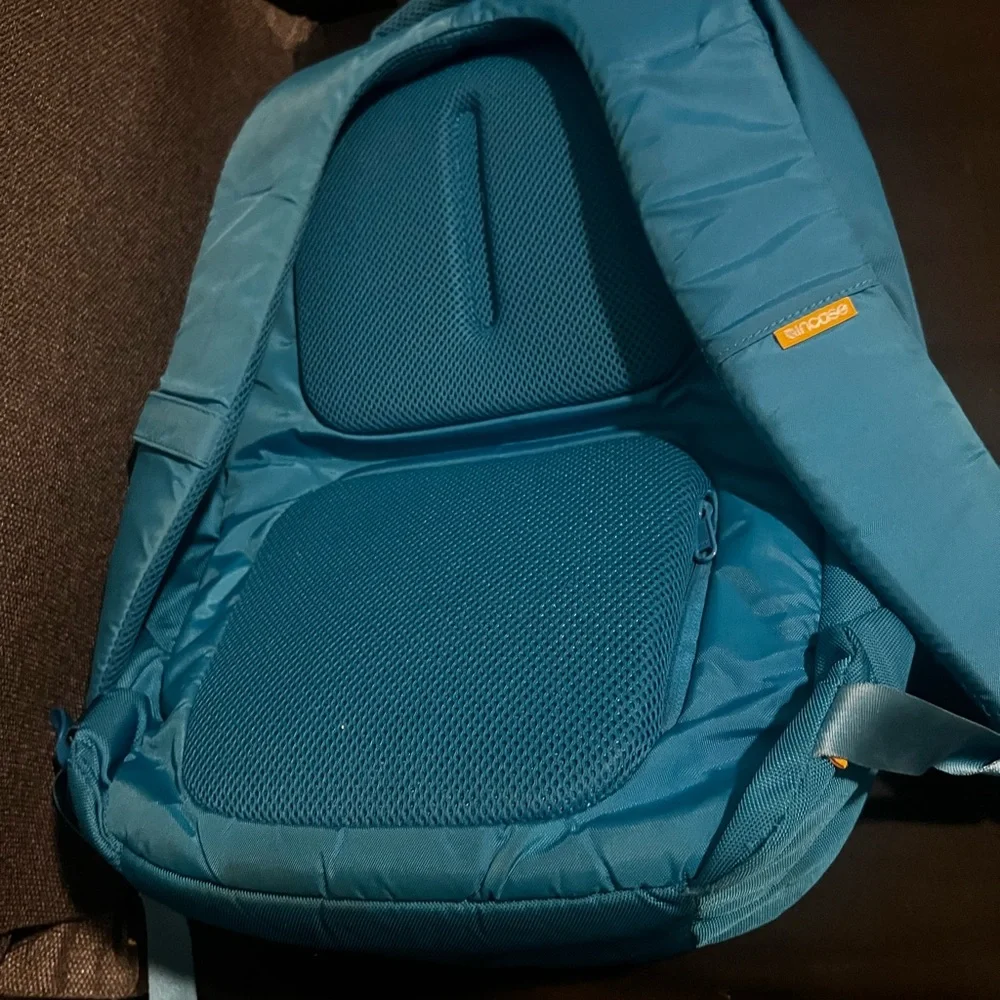 Incase Teal Backpack with Yellow Zipper